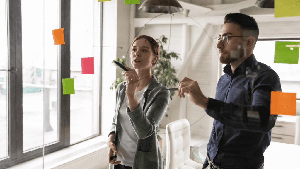 Two person optimizing their team's workflows.